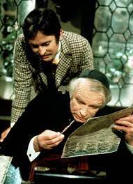 Bassanio et Shylock , qui consulte le taux d'usure fixé par la bourse.